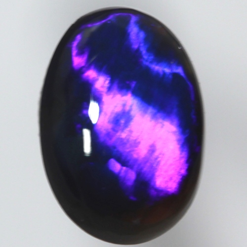 SOLID BLACK OPAL Bright electric blue. Broad rolling flash